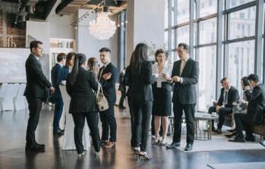 group of real estate agents gather 为 real estate networking